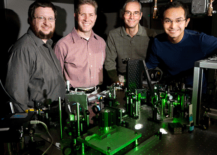 Image: A team of Illinois researchers developed an imaging technique that uses laser light to identify cancer cells. The fast, accurate technique could lead to real-time optical biopsies. From left, Eric Chaney, a research specialist at the Beckman Institute; Stephen Boppart, a professor of electrical and computer engineering, of bioengineering and of medicine; Martin Gruebele, a professor of chemistry and of physics; and Wladamir Benalcazar, a graduate fellow at the Beckman Institute (photo courtesy L. Brian Stauffer / University of Illinois).